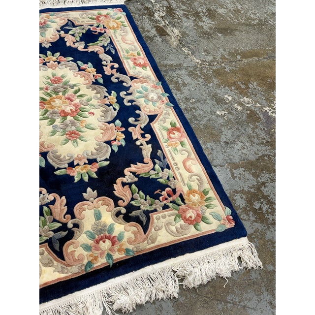 Design Plus Gallery presents a 4 ft x 6 ft Chinese Floral Oriental Area Rug. This circa 1979 hand woven wool rug displays...
