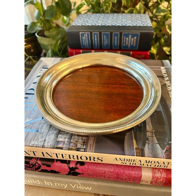 This petite tray offers a space to serve or organize on your bar cart or buffet. Made by Revere in the 1970’s, it features...