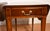We are pleased to offer this beautiful pair of Pembroke drop-leaf side tables, from the 1950s . This pair is made of...