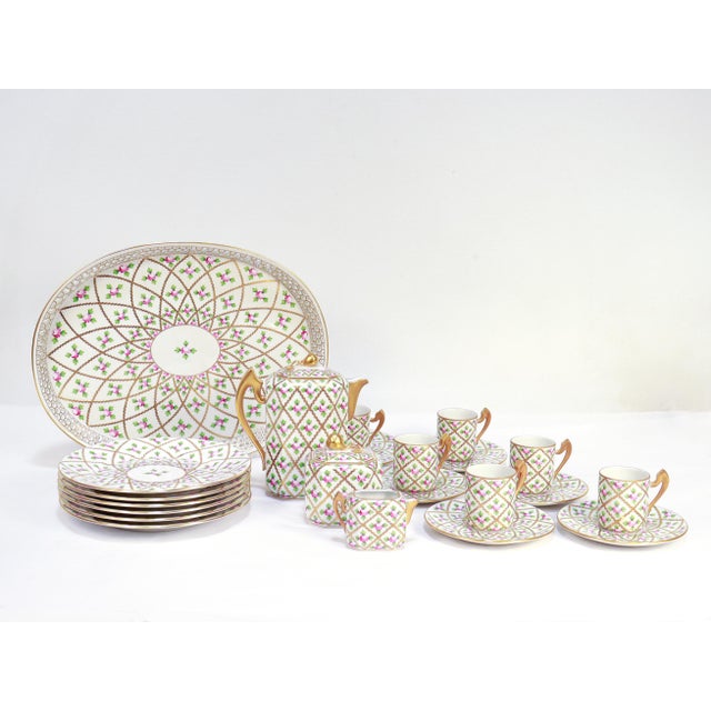 A fine vintage demitasse porcelain set. By Herend. In the Sevres or Petite Rose pattern. (Pattern abbr: SPROG) With a gilt...