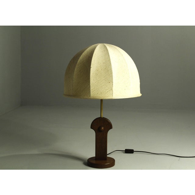 Large table lamp by Temde leuchten mod. 5559. Oak base with fabric shade. Sculptural shape with a pleasant atmosphere of...