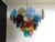 Italian murano chandelier. The chandelier has 50 murano multicolored glass disks. The glasses are now unavailable, they...