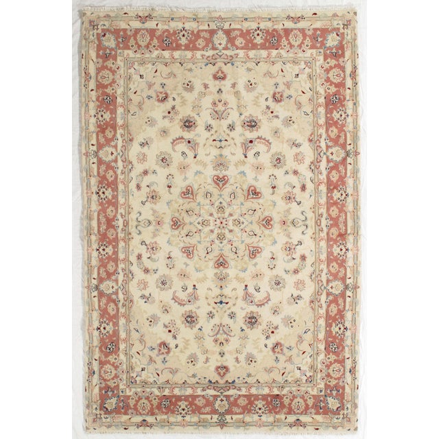 Vintage Hand-knotted Persian Tabriz rug from northwest Iran, known for its fine weave and detailed floral patterns....