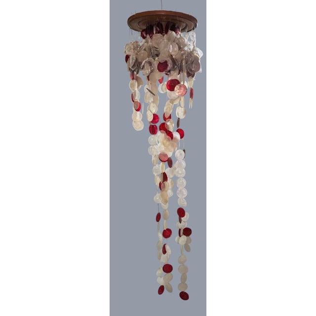 Vintage Mid-Century Modern Capiz shell hanging chandelier sculpture in an exceptionally rare red and white colorway....