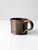 This vintage studio pottery mug features a deep brown glaze accented by a contrasting drip glaze at the rim and subtle...