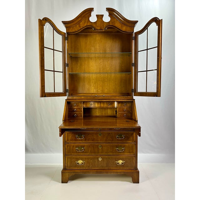 This sophisticated two-piece secretary desk and hutch by the prestigious White Fine Furniture Company (Mebane, NC) is a...