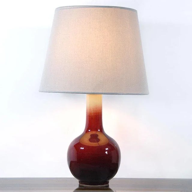 Decorative table lamp from Italy from the 1970s. The base is made of ceramic decorated with a very effective glaze called...
