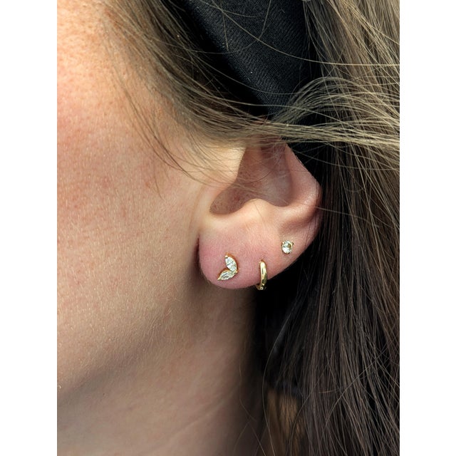 Sweet, sparkly, and full of golden charm—these marquise-shaped two-stone studs in real 14k yellow gold are a perfect pick...