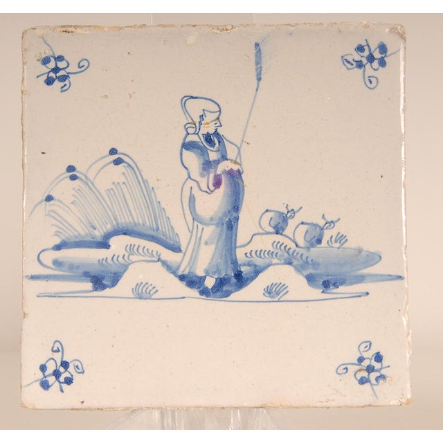 2 Dutch Delft blue and White tiles Depicting figures in a landscape Origin Netherland second half 17th century Condition:...