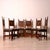 Beautiful set of 6 carved wooden chairs, featuring a high, decorated backrest and a dark brown, padded seat. Their design...