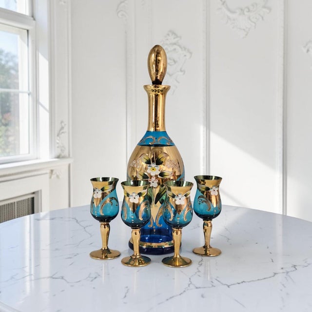 A refined mid-century Venetian art glass cordial service comprising a hand-blown decanter with its original hand-ground...