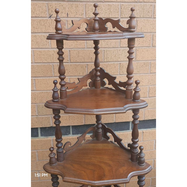 A 19th Century Victorian period Rococo Style Mahogany Corner Etagere. Measures 24" in width, 17" in depth and 60" in...