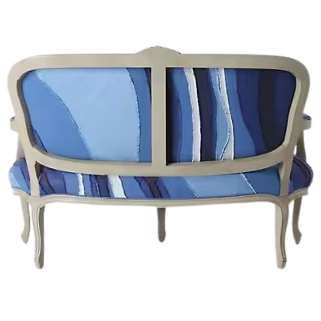 Authentic Anthropologie “Louisa” settee featuring a striking vintage-inspired blue patchwork upholstery. This elegant...