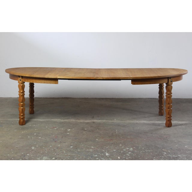 A sculptural expression of Danish mid-century modernism, this brutalist oval oak table embodies the bold yet reverent...