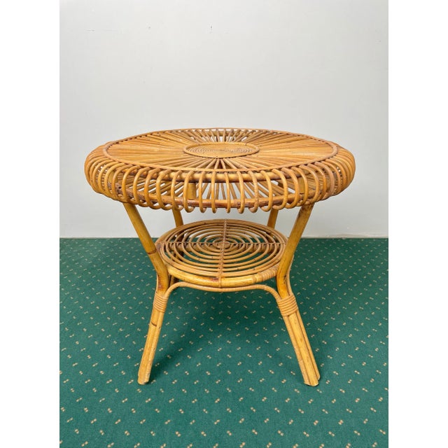 Mid-Century Modern round coffee table with double shelves completely in bamboo and rattan made in Italy in the 1960s.