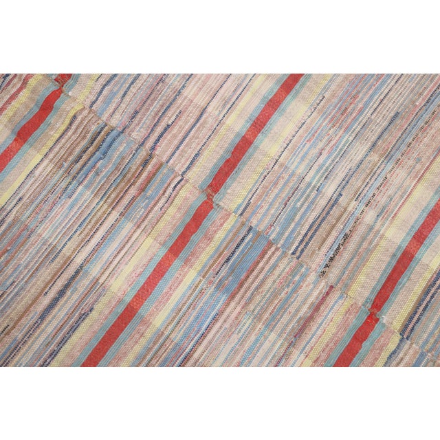 A large rare corridor size American Rag rug from the early 20th century Measures: 8' x 18'1''.