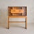 An Italian two-tier wooden cabinet attributed to Paolo Buffa, dating to the 1940s. Designed in the spirit of the Art Deco...