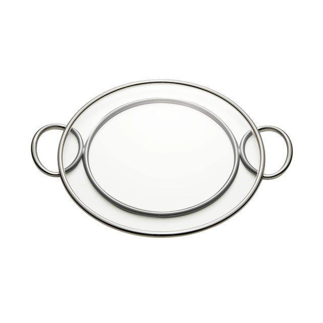 This is a smooth and shiny stainless alloy Binario tray with handles.
