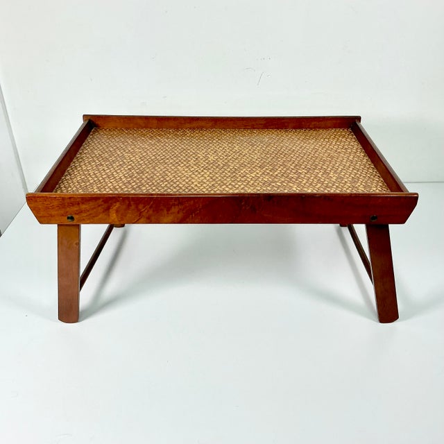 A lovely folding lap tray for breakfast in bed or working on your electrical devices. It features a wood frame in a deep...