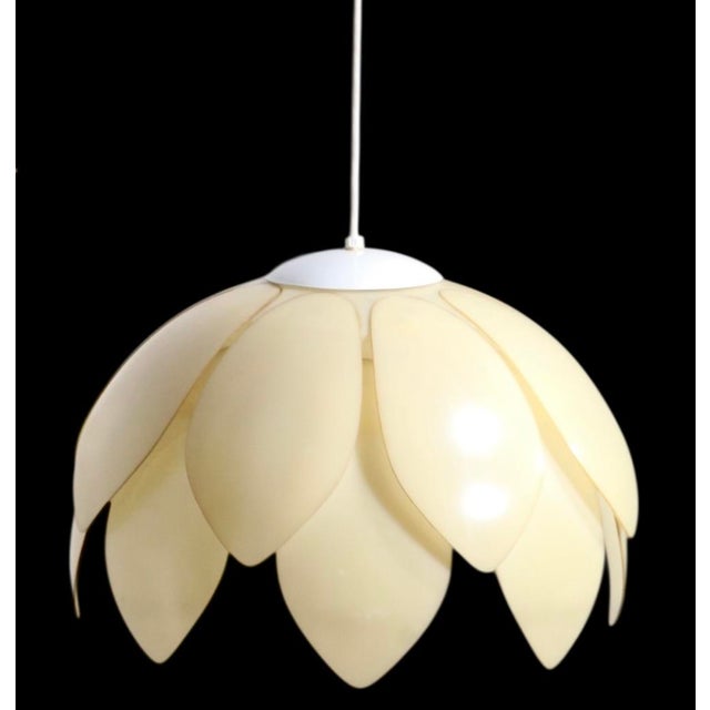 Cool Mod style plastic hanging shade, having layered pedal form shades which create a dome form fixture. The shade is in...