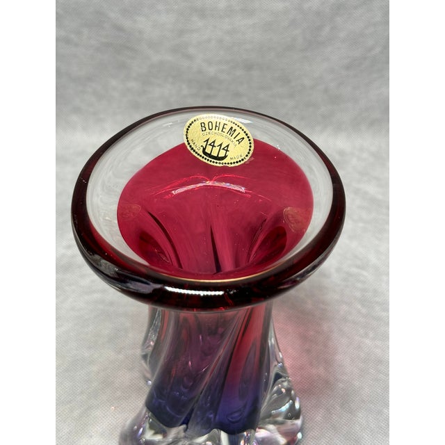 Vase with a vibrant pink-to-purple gradient and a sculpted base. A striking decorative piece with the character of Bohemia...