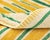 A rhythmic march of stripes, warm and grounded. This hand-knotted wool rug builds its impact through repetition — fine...