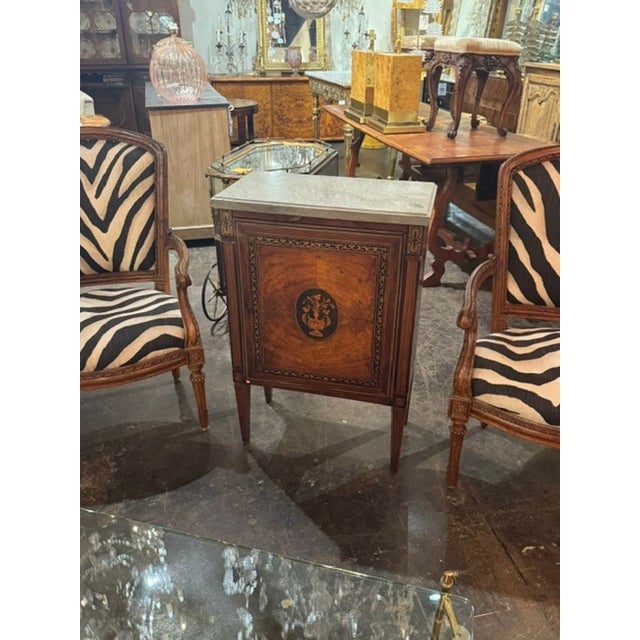 This early 19th century Italian inlaid walnut marble top side table is a rare and valuable antique piece of furniture. The...
