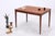 Vintage teak dining table with extendable tabletop. The clean lines, slender legs, and warm wood color blend beautifully...