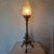 1920s Art Deco electrified candlestick in bronze with a satin glass flame globe. Height without globe: 55cm European Plug...