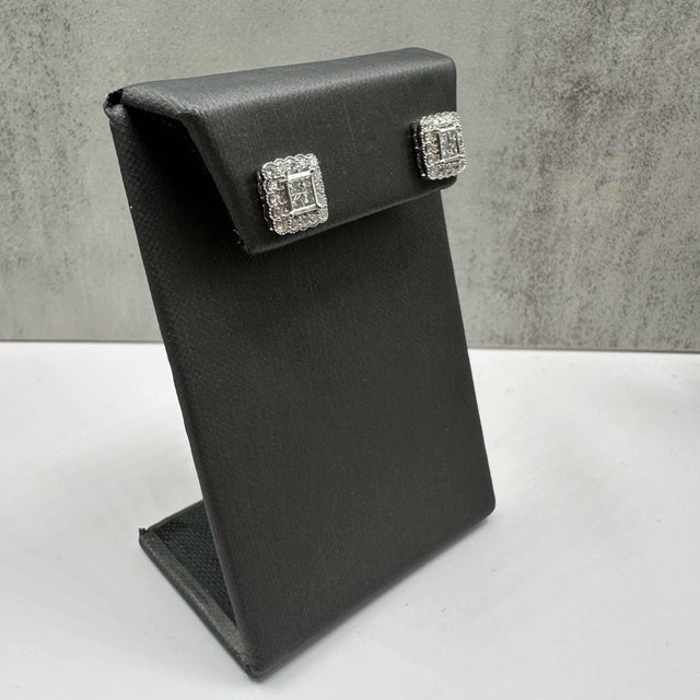 These stunning Diamond Stud Earrings in 14kt white gold feature 1ctw of natural GH SI princess cut and round diamonds,...