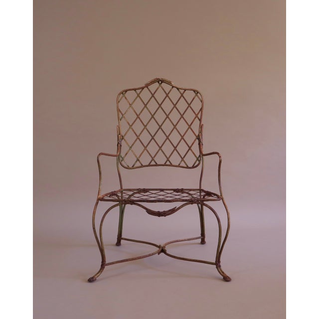 Rose Tarlow style "Twig" outdoor set of (4) chairs and (1) Ottoman. Wrought iron metal frames in forms of twisting vines...