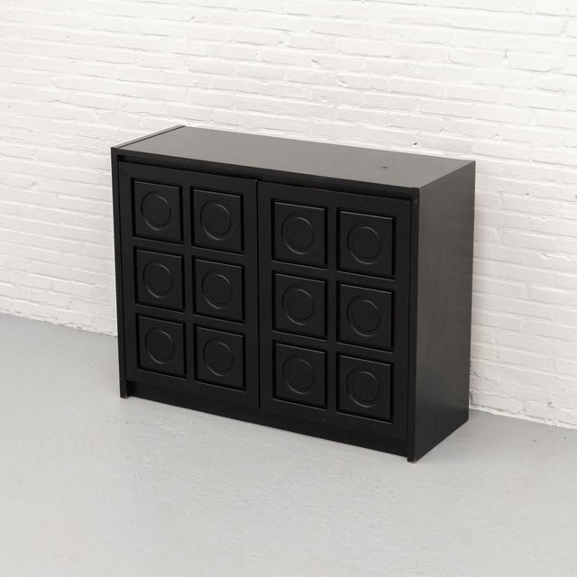Belgian Brutalist cabinet from the 1970s, made in black-stained wood with a warm oak interior. The front is composed of...