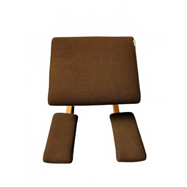 Excellent condition for age and use. Warm beech wood and original brown wool upholstery. The seat gently tilts the pelvis...