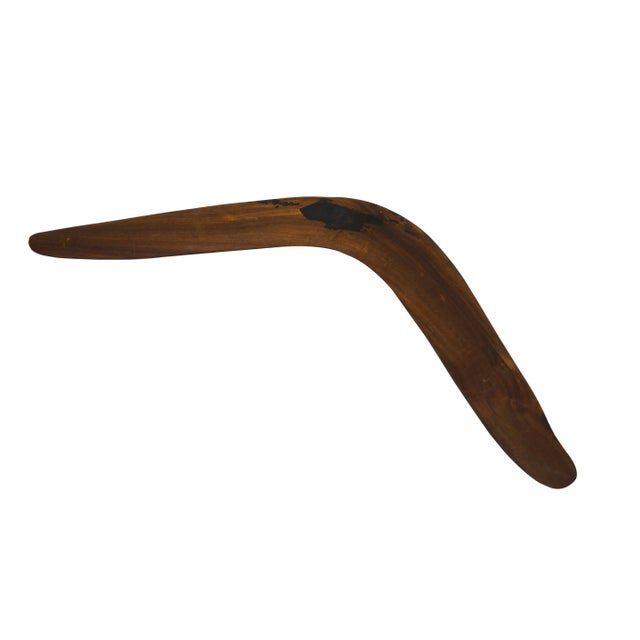 Vintage Australian aboriginal carved wooden boomerang. Purchased in Australia, 1987. Dimensions: 18.75" x 8" x 0.25"...