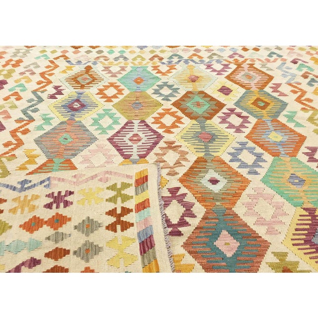 Authentic hand-woven kilim from the Maimana tribes of Northern Afghanistan, crafted with wool on wool foundation. This...