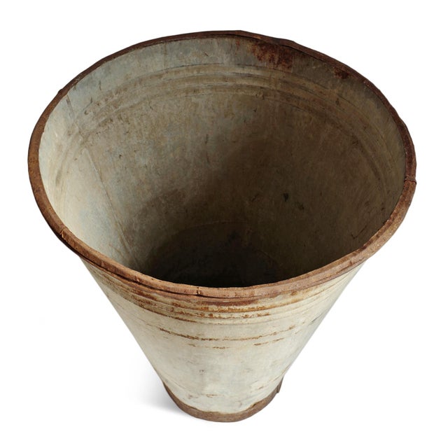 Beautifully aged vintage French galvanized metal bin featuring a softly tapered silhouette and timeworn patina rich with...