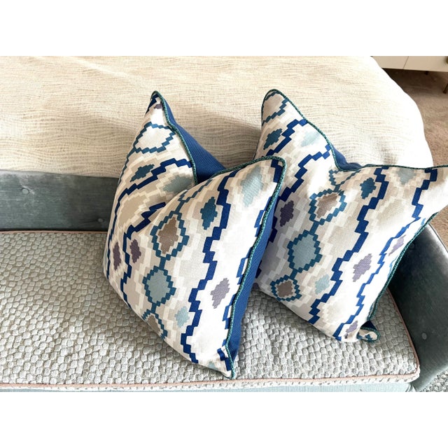 A pair of modern pillows made with Romo’s geometric linen print (front) and Perennials canvas in blue (back). Accented...