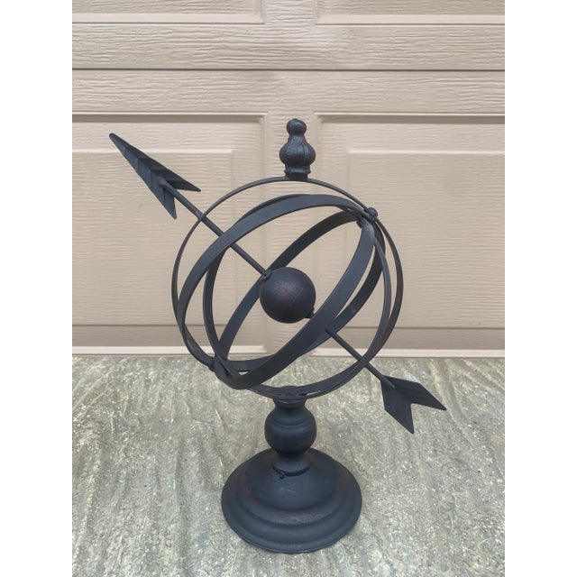 A beautifully crafted iron armillary sphere, evoking the timeless elegance of classical European gardens. Pieces like this...