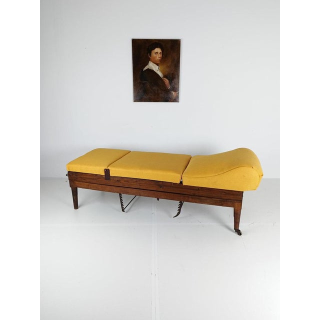 This is a rare English military hospital bed from the 19th century, crafted by an unknown maker. It has been carefully...