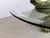 Elegant brass dolphin sculpture that has been given a weathered bronze look being depicted as its surfacing from the...