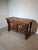 Impressive carved wooden altar or architectural console executed in a Gothic style, featuring richly sculpted tracery...