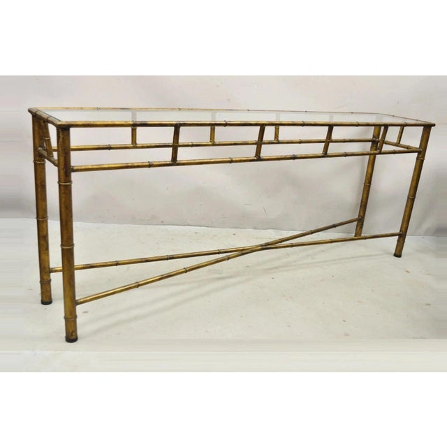 Vintage Italian Hollywood Regency Faux Bamboo Burnished Gold Gilt 72" Console Hall Table with Glass Top. Circa Mid 20th...