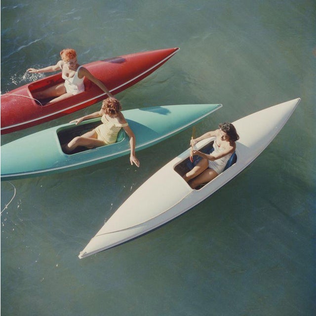 Lake Tahoe Canoes (1959) Limited Estate Stamped (Photo By Slim Aarons) Young women canoeing on the Nevada side of Lake...
