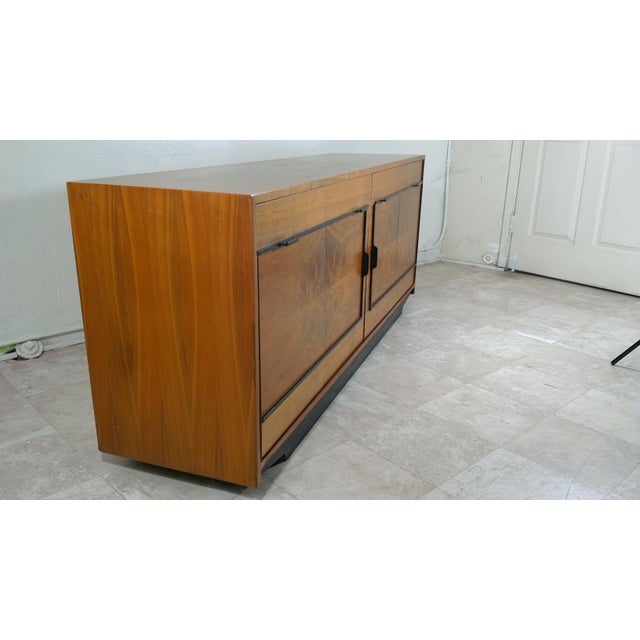Stunning credenza made out of walnut wood. Professionally refinished , grain of the wood shows nicely. Circa 1960's. It...