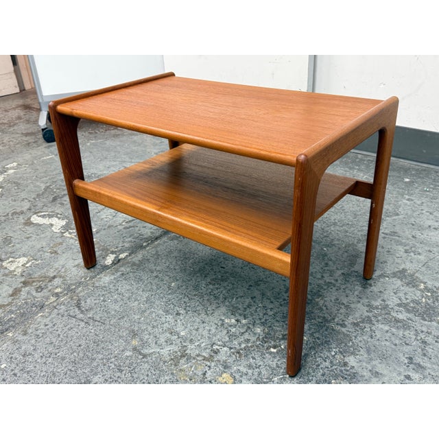 Design Plus Gallery presents a Mdi 20th Century Side Table from Salin Nyborg. This teak two-tier table (Model 5800) shows...