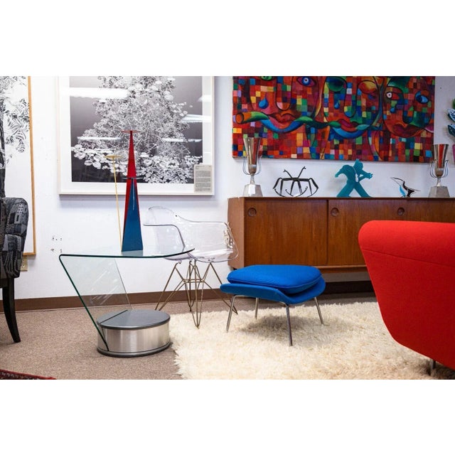 A pair of Brueton style contemporary modern side end tables. Each of these tables features a very sleek, modern design,...