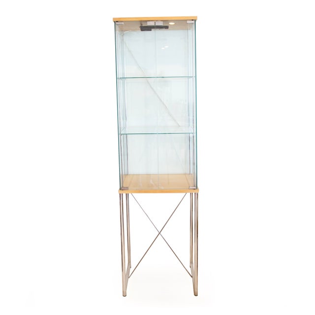 Pair Of Glass And Blond Wood Display Cases 20th century, probably circa 1980s 67 1/2" H x 18 1/4" W x 14" D Pair of narrow...