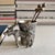A highly detailed vintage German pewter match or toothpick holder featuring a dimensional bull moose standing beside a...
