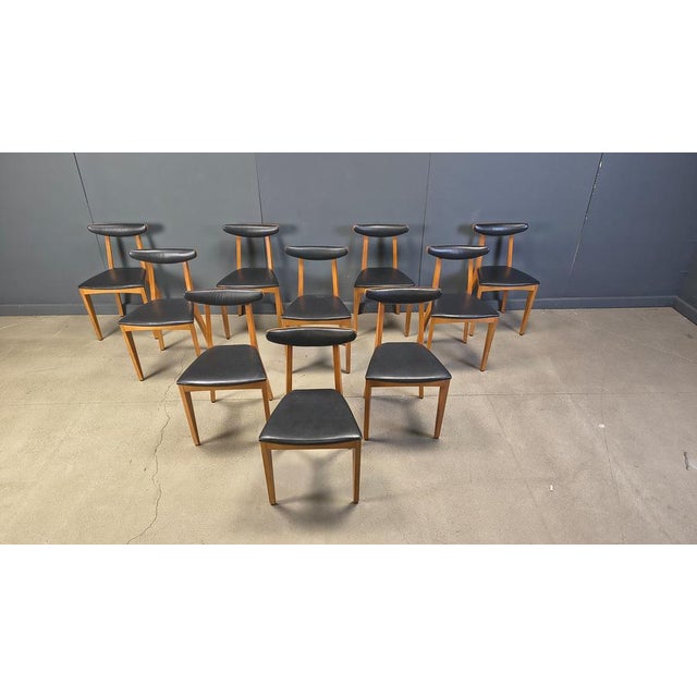 Set of 6 mid century italian dining chairs with a finely crafted wooden frame and leatherette upholstery. Scandinavian...