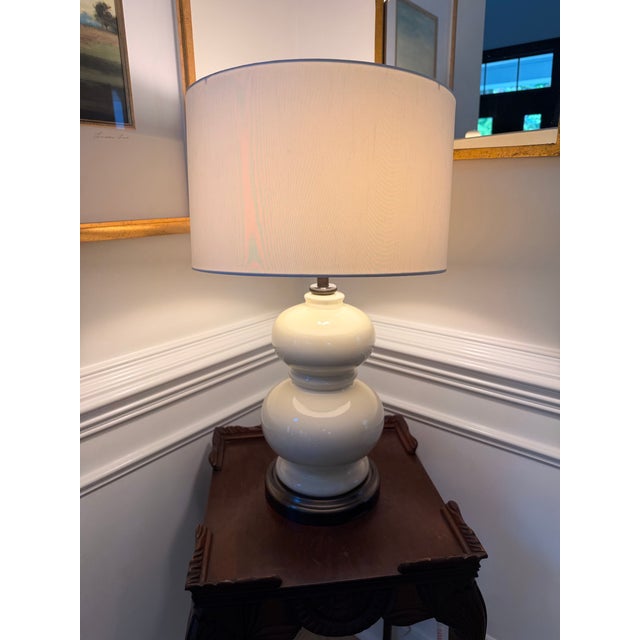 Classic and versatile Pottery Barn ceramic table lamp featuring a sculptural double-gourd silhouette in a warm cream...